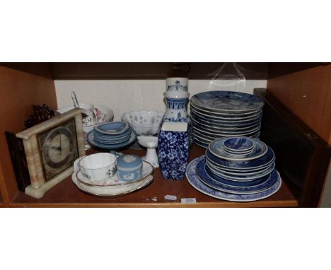 A set of twelve Delft blue and white plates depicting the months of the year together with other examples by Delft Wedgwood a