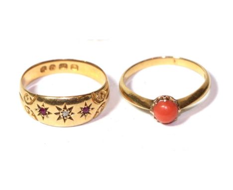 A 18 carat gold ruby and diamond three stone ring, finger size Q; and a coral ring stamped '18CT', finger size P.  Gross weig