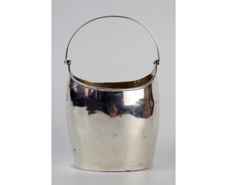A provincial silver swing handled sugar basin, maker Richard Ferris, Exeter, no date letter, of oval outline, with reeded han