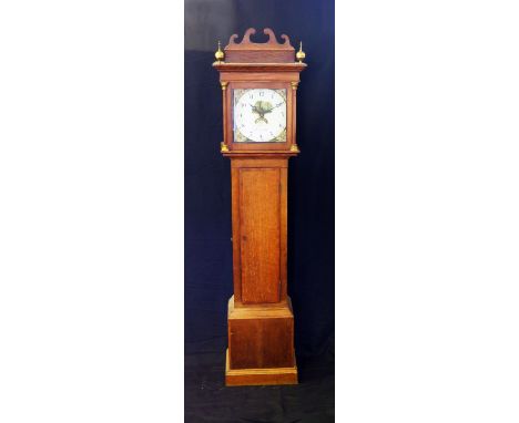 Pinn, Exmouth, a late 18th century oak longcase clock, the hood with broken swan neck and turned columns, the trunk with cros