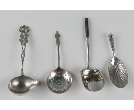 Three assorted silver caddy spoons, and a ladle, various makers and dates, 44gms, 1.44ozs (4) 