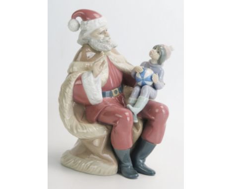 A Lladro figure group 'Papa Noel' No 5711, 19cm high, boxed. 