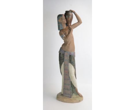 A Lladro figure of an Egyptian water carrier, 57cm high. 