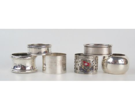 Six assorted silver and plated napkin rings, including SS Highlander Rover napkin ring, total weight of silver 64gms, 2.08ozs