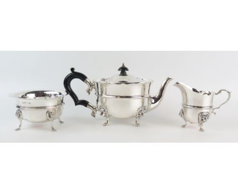 A matched three piece tea service, maker William Bruford &amp; Son, London 1928 and Birmingham, 1908, of circular form with w