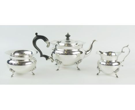 An Edward VII silver three-piece tea service, maker J Sherwood &amp; Sons, Birmingham, 1909, of circular outline with wavy ed