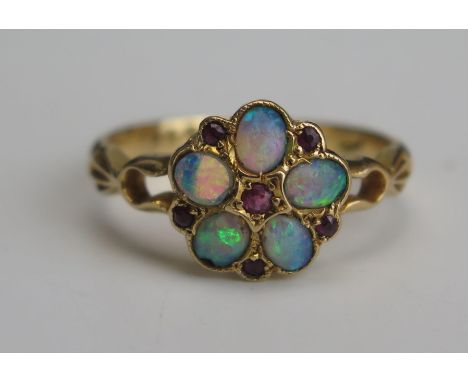 An Antique 18ct Gold, Opal and Ruby Cluster Ring, 10mm head, Chester 1909, size M.25, 3g. Two stones A/F 