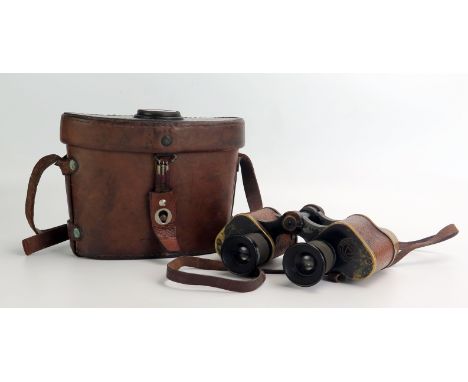 A pair of U.S. Army field glasses, stamped Signal Corps, U.S. Army, Serial No EE286918, contained in a stitched leather case 