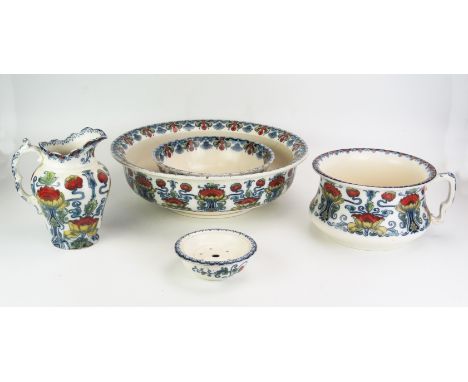 An Art Nouveau influence Staffordshire pottery five-piece toiletry set, with polychrome floral transfer print decoration, inc