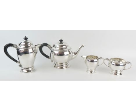 A George V silver four-piece tea service, maker William Neale, Birmingham, 1926, of ovoid form with gadrooned borders, raised