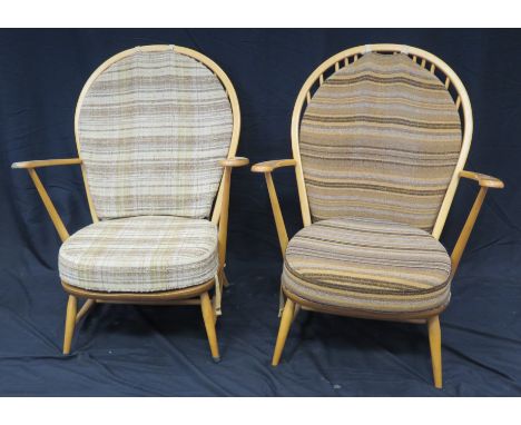 A pair of Ercol elbow chairs, with loose cushion padded back and cushion  seat, raised on turned underframing. (2). 