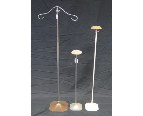 Two vintage adjustable hat stands, together with an adjustable scarf stand. (3) 