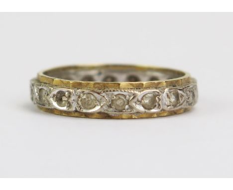 An 18ct Gold and White Stone Eternity Ring, 4.5mm wide, size O.75, 4.3g 