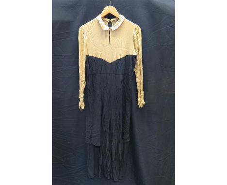 A 1920's ladies cocktail/evening dress, with gold lame V-shaped bodice section and arms, with black dress below, together wit