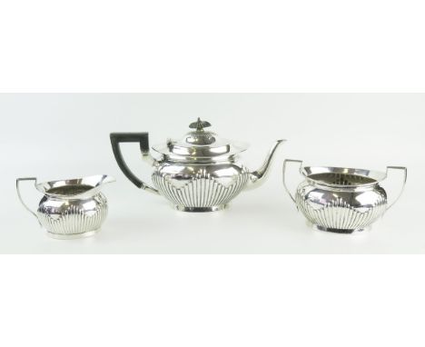 A George V silver three-piece tea service, maker Thomas Ellin &amp; Co Ltd, Sheffield, 1912, of oval outline with half reeded