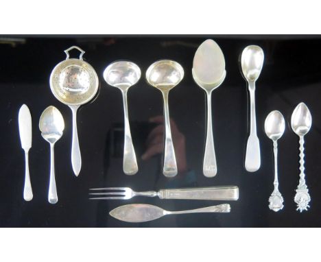 A mixed collection of silver flatwares, various makers and dates, includes sauce ladle, preserve spoon, butter knife, fork an