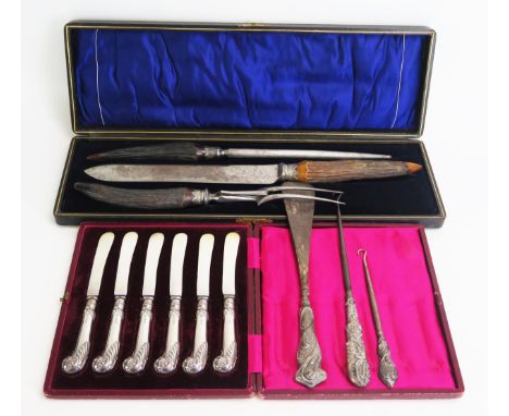 A set of six silver pistol handled butter knives, cased, and antler handled carving set cased, button hook, shoe horn etc. 