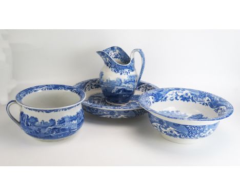 A Spode blue and white 'Italian' pattern toilet set including wash basin, water jug, chamber pot and large shallow bowl. (4).