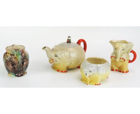 A Royal Venton ware pottery three-piece tea set modelled as elephants includes tea pot, cream jug and sugar basin together wi