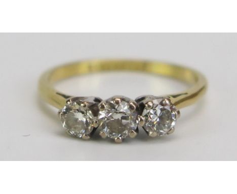 An 18ct Gold and Diamond Three Stone Ring, c. 3.8mm stone, stamped marks, size I.75, 2.16ct 