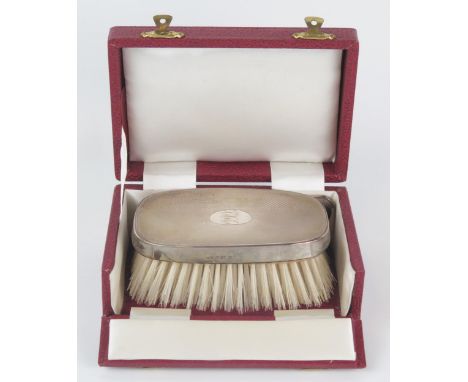 An Elizabeth II silver backed gents brush and comb set, maker Deakin &amp; Francis Ltd, Birmingham, 1974, initialled, cased. 