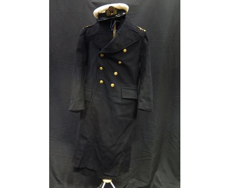 A Royal Naval Reserve commanders jacket, hat and long coat, together with a pencil sketch of the owner in uniform. 