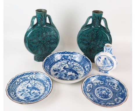 A pair of Chinese pottery moon flasks with loose foliate decoration to a blue/green ground, impressed four character mark, 28