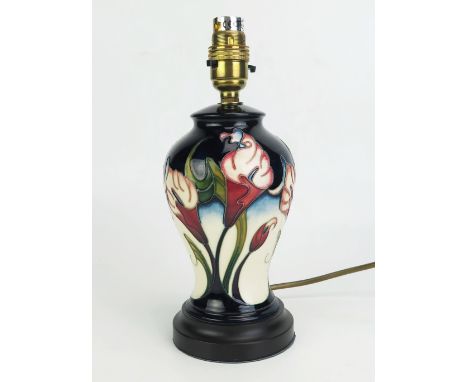 A Moorcroft pottery table lamp base, in the Calla Lily pattern, of baluster, on a stepped circular base, 19.5cm high (excludi