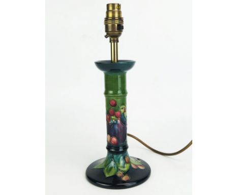 A Moorcroft pottery table lamp, in the form of a candlestick with Pomegranate and Finches pattern, 21cm high (excluding fitti