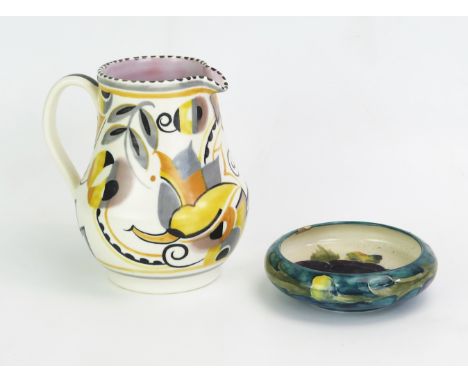 A Poole Pottery Ye pattern cream jug, by Truda Carter, 14,5cm high, together with a Moorcroft pottery dish, 11cm diameter, ch