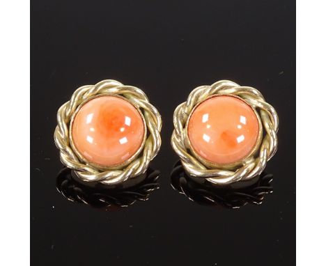 A pair of 9ct gold cabochon coral earrings, with clip fittings and rope twist surround, earring diameter 21.3mm, 13.4gConditi