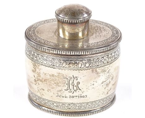 A late Victorian oval barrel-shaped silver tea caddy, with engraved floral and acorn decoration with gadrooned border, indist