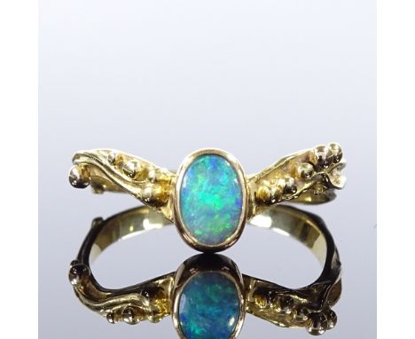 An unmarked gold opal wishbone ring, relief berry shoulders, setting height 8.2mm, size T, 3.5gCondition Report: Very good or