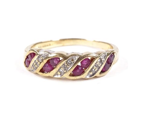 A 9ct gold ruby and diamond half-hoop ring, setting height 4.9mm, size K, 2gCondition Report: Very good original condition, a