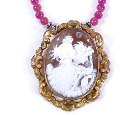 A relief carved cameo shell panel and polished pink amethyst necklace, depicting female busts, in pinchbeck frame, on amethys