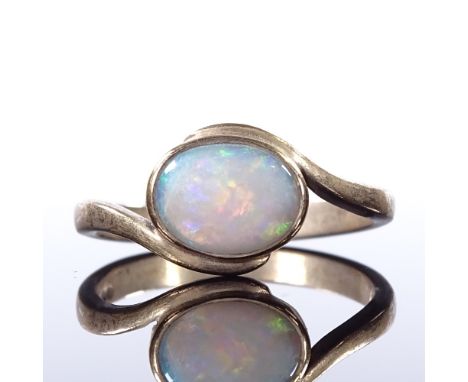 A 9ct gold opal dress ring, crossover style settings, setting height 9.5mm, size Q, 3gCondition Report: Good original conditi