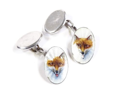 A pair of Continental silver and enamel hunting fox head oval cufflinks, panel length 18.8mm, 6.5gCondition Report: Cufflinks