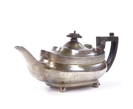 A George V silver teapot, oval squat form with bun feet, by Joseph Rodgers &amp; Sons, hallmarks Sheffield 1921, teapot heigh