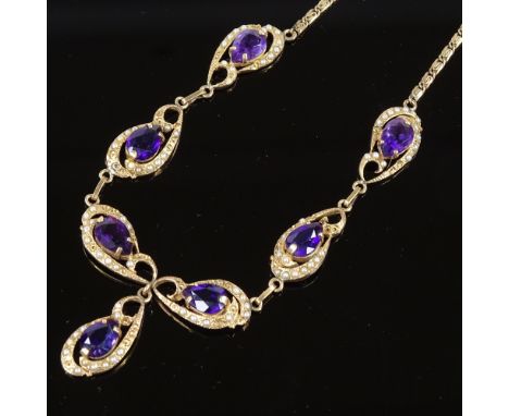 A 14ct gold amethyst and split pearl collar necklace, pierced and scrolled decoration with pear-cut amethyst and fancy link c