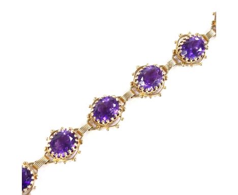 A 14ct gold amethyst bracelet, pierced panel settings, bracelet length 17.5cm, 16.7gCondition Report: Very good original cond