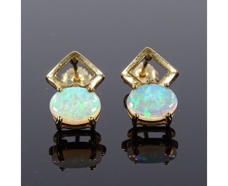 A pair of 9ct gold opal earrings, stud fittings with openwork settings, height excluding fitting 13.3mm, 2.2gCondition Report