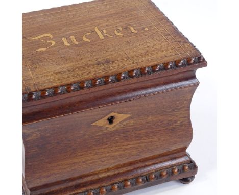 A 19th century Continental mahogany tea caddy, the lid inscribed Bucker, in beaded surround with ogee sides, 15cm x 12cm x 13