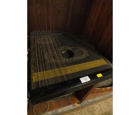 A VINTAGE PIANO-CHORD STRING INSTRUMENT 