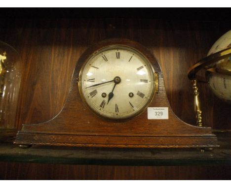 A VINTAGE OAK NAPOLEON HAT MANTLE CLOCK 