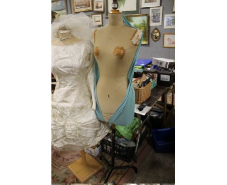 A VINTAGE DRESS MAKERS MANNEQUIN ON METAL STAND 