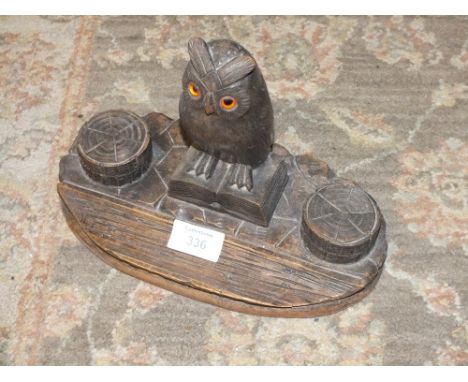 A TREEN TWIN INKWELL DESK STAND WITH OWL FINIAL 