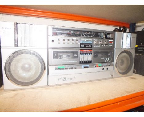 A SHARP TWO-WAY SPEAKER SYSTEM WITH ATTACHED MUSIC PROCESSOR