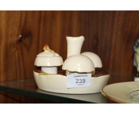 A CARLTONWARE MUSHROOM SHAPED CRUET SET