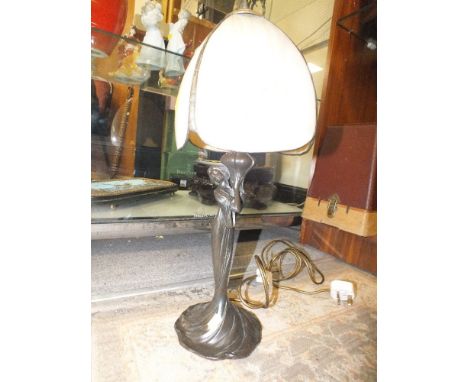 A FIGURATIVE LAMP WITH TIFFANY STYLE SHADE 