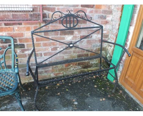 A CAST GARDEN BENCH FRAME - LACKING SEAT